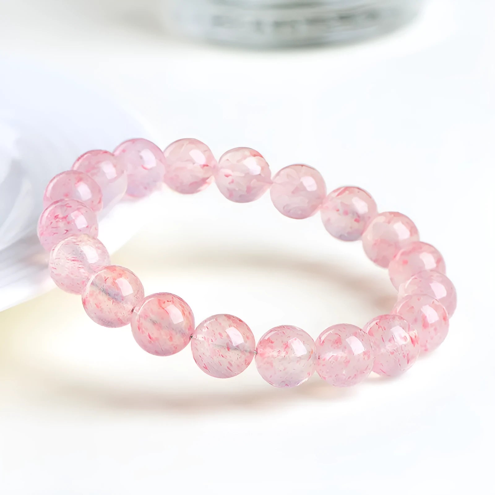 Natural strawberry quartz crystal bracelet with geometric sphere beads measuring 10-10.8mm
