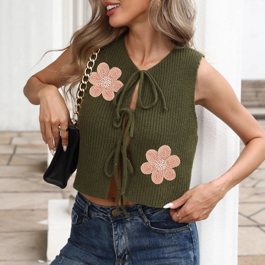Women's white sleeveless cardigan with lace-up bow front and apricot flower pattern on deer plush fabric.