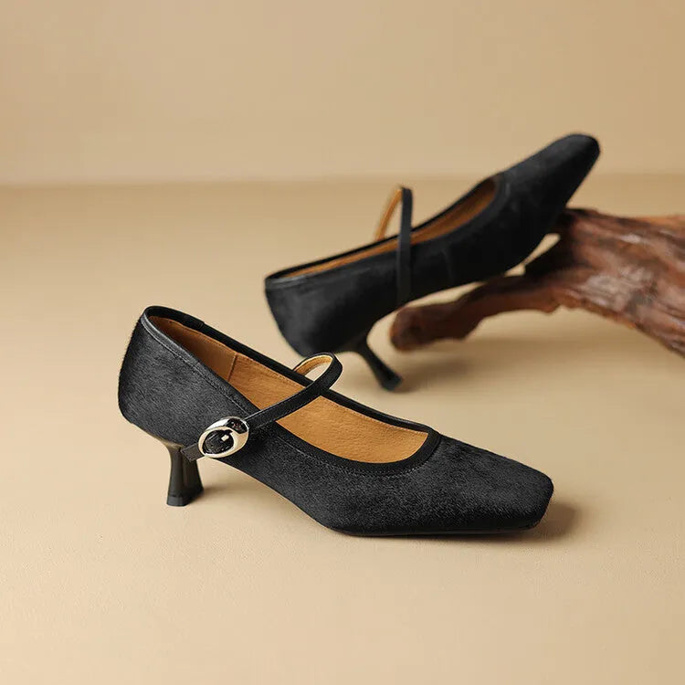 Women's black square toe stiletto heel ankle-strap shoes with horse hair upper and buckle closure.