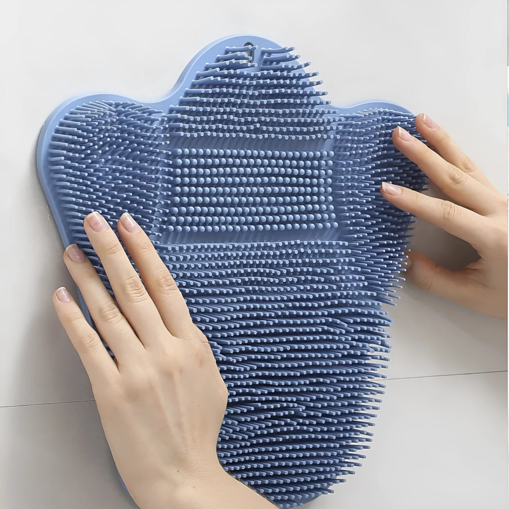 Blue silicone bath massage cushion mat with textured surface for handheld scrubbing.