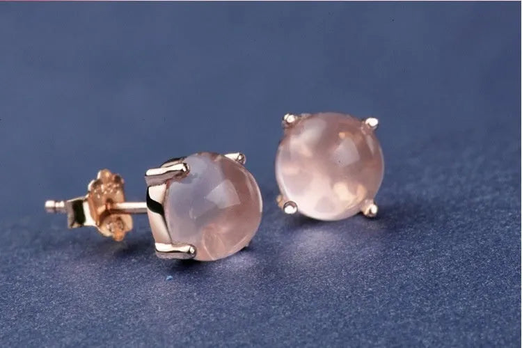 Rose gold drop shape stud earrings with synthetic quartz crystal inlay