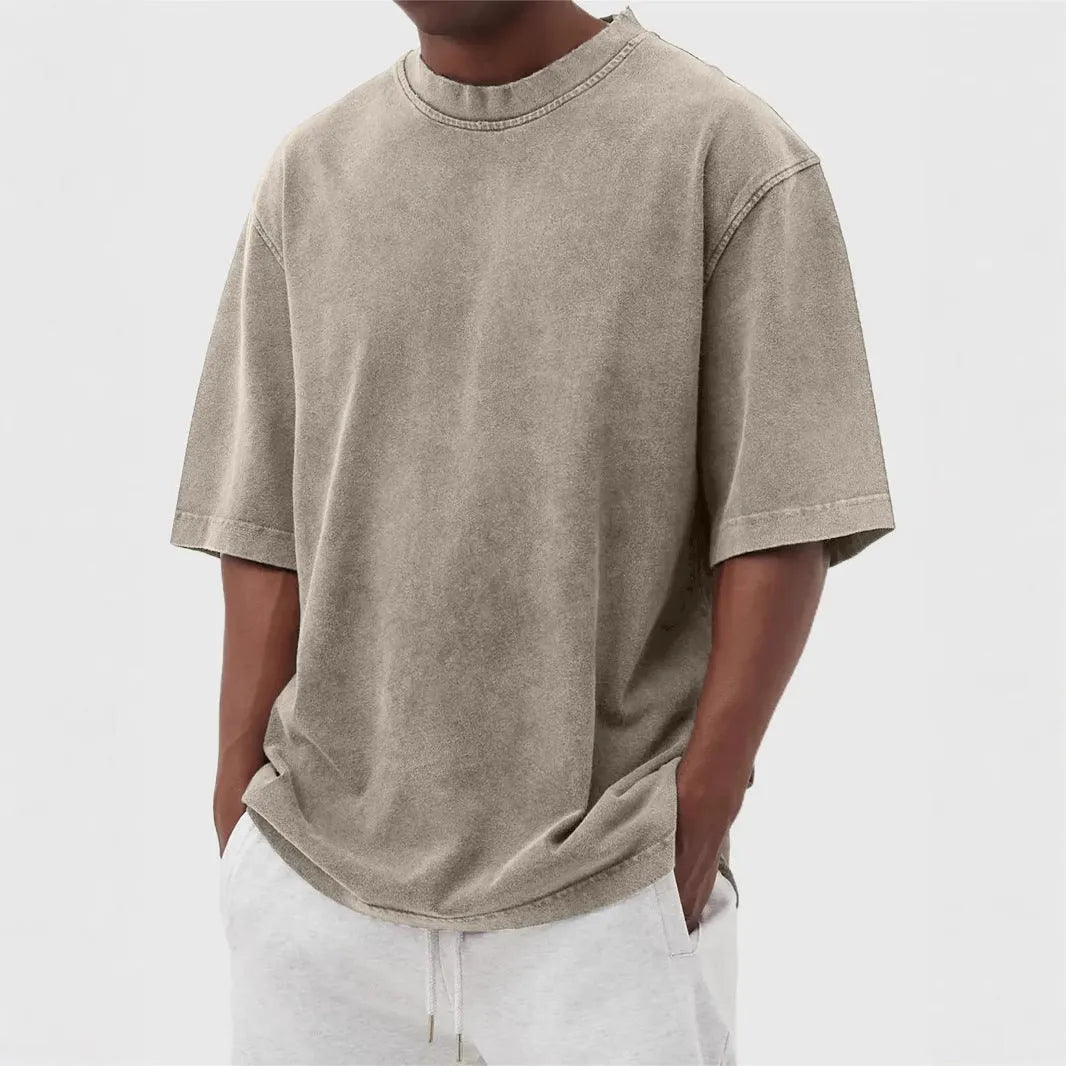 Men's stone washed distressed t-shirt in loose fit with half sleeves available in multiple colours