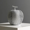 Decorative resin apple and pear crafts in white, orange, black, and blue on a shelf.