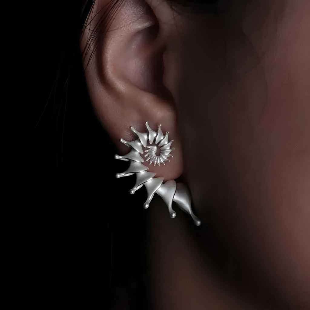 Three-dimensional matte finish conch shell stud earrings with exaggerated design and irregular patterning