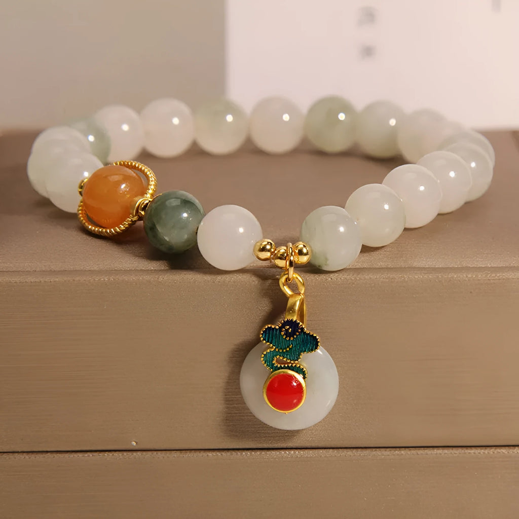 Women's ice jade bracelet with pearl accents and xiangyun peace jade buckle in retro design