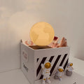 Maglev floating moon planet night light with astronaut figurines and LED illumination