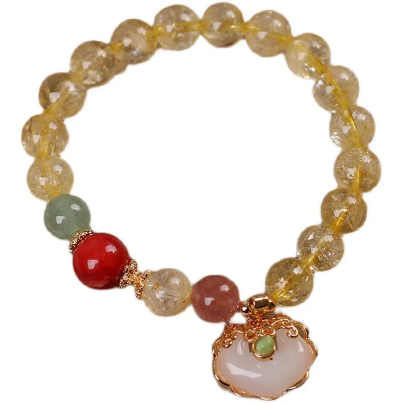 Women's bracelet with a yellow citrine jade ruyi pendant on an alloy chain.