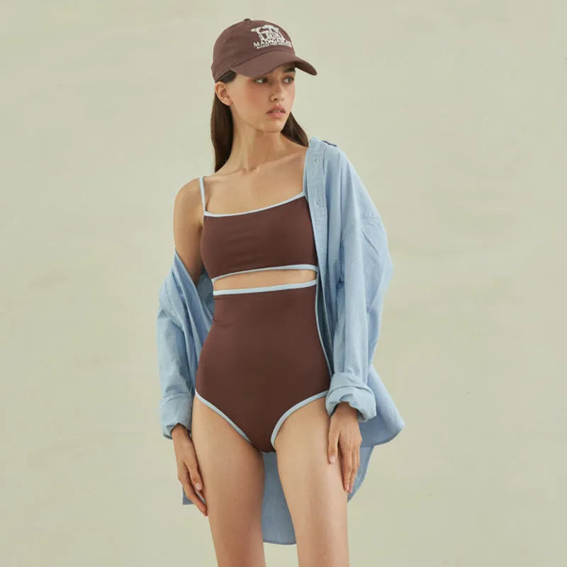 Brown women's one-piece swimsuit with a triangle top on a mannequin.