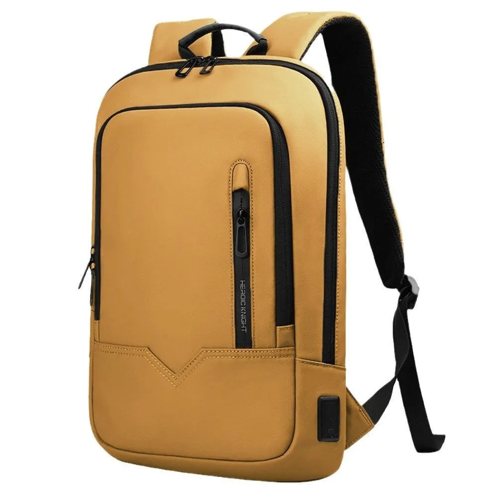 Lightweight grey polyester computer backpack with USB charging port on the shoulder strap