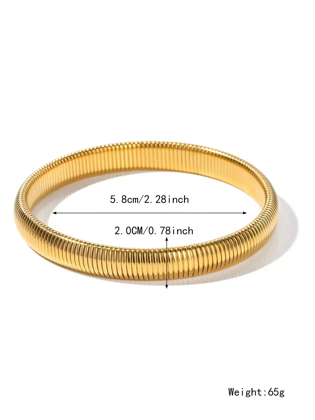 A gold women's elastic titanium steel bracelet with an exaggerated vertical stripe ring design, shown laid flat.