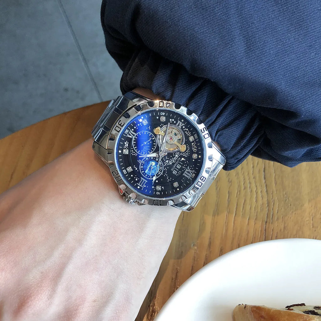 Men's silver automatic watch with black starry luminous dial and leather strap