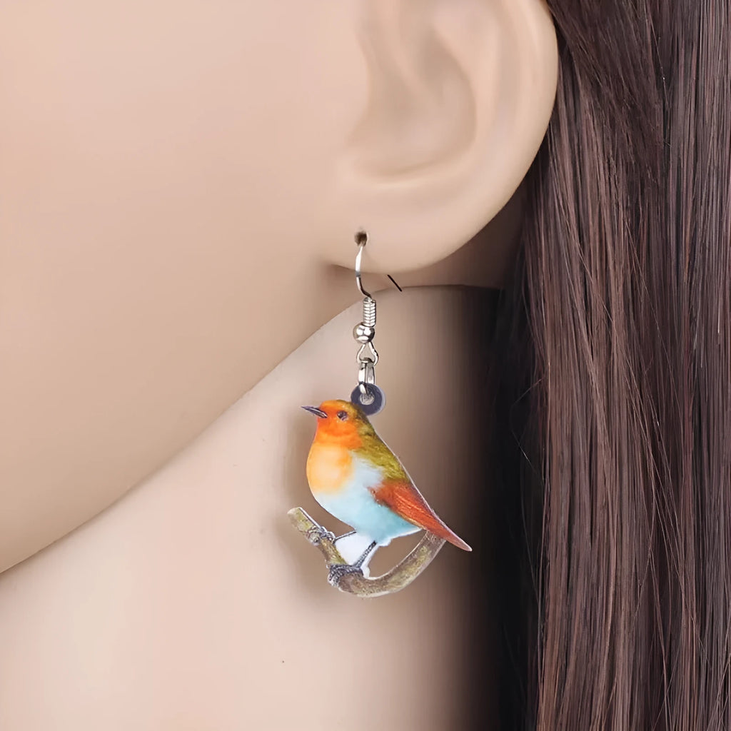 Blue titmouse pendant acrylic earrings with geometric snake motifs in two colour options