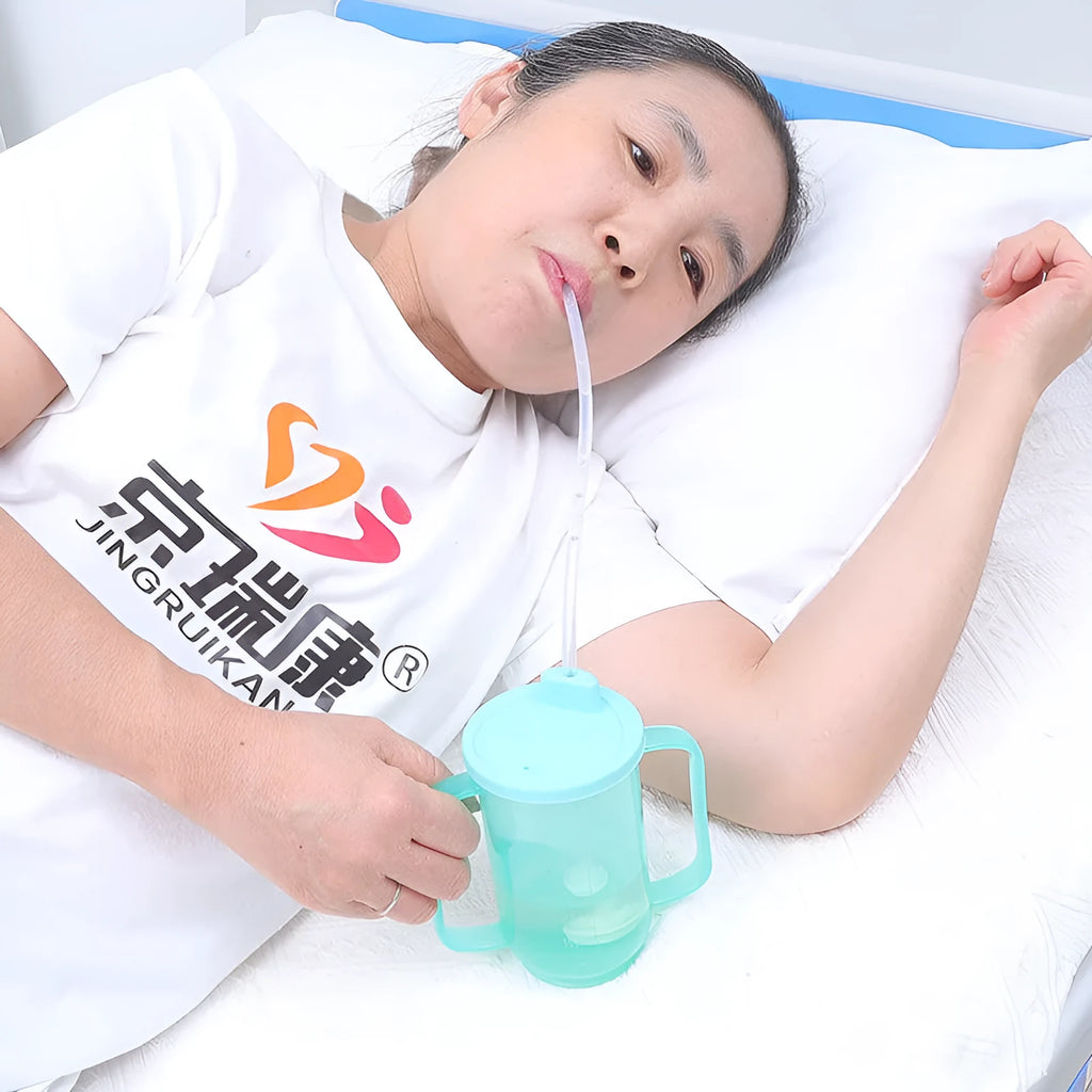 Bedside drinking cup with oblique anti-choke spout and handle for elderly and pregnant women