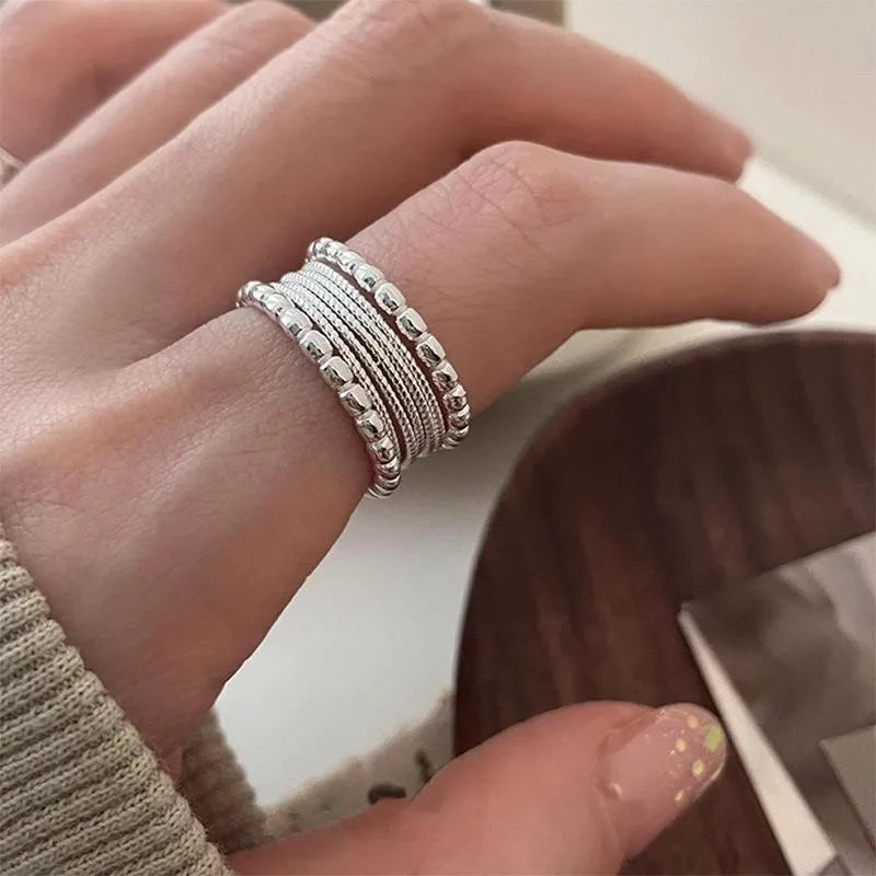 Adjustable opening copper ring with woven twisted multilayer geometric design