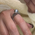 Geometric black pearl open finger ring with adjustable copper construction on female hand