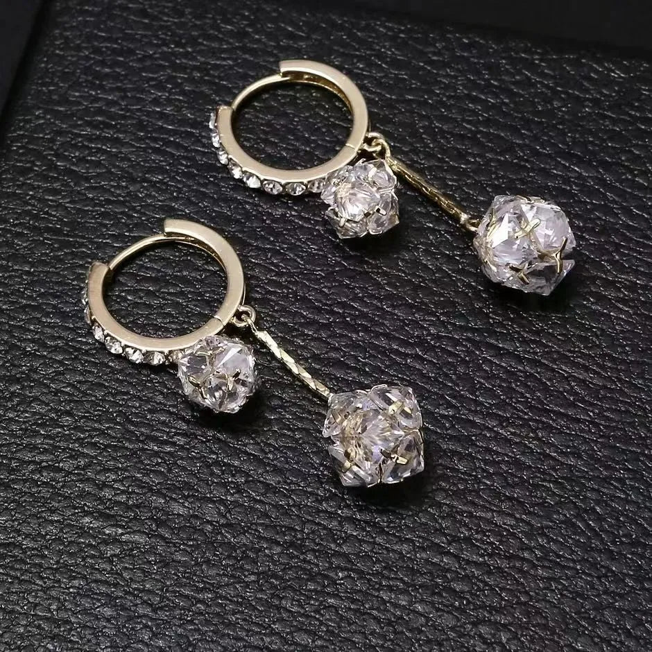 Silver colour women's earrings with tassel ball and rhinestone accents featuring confession balloon motif