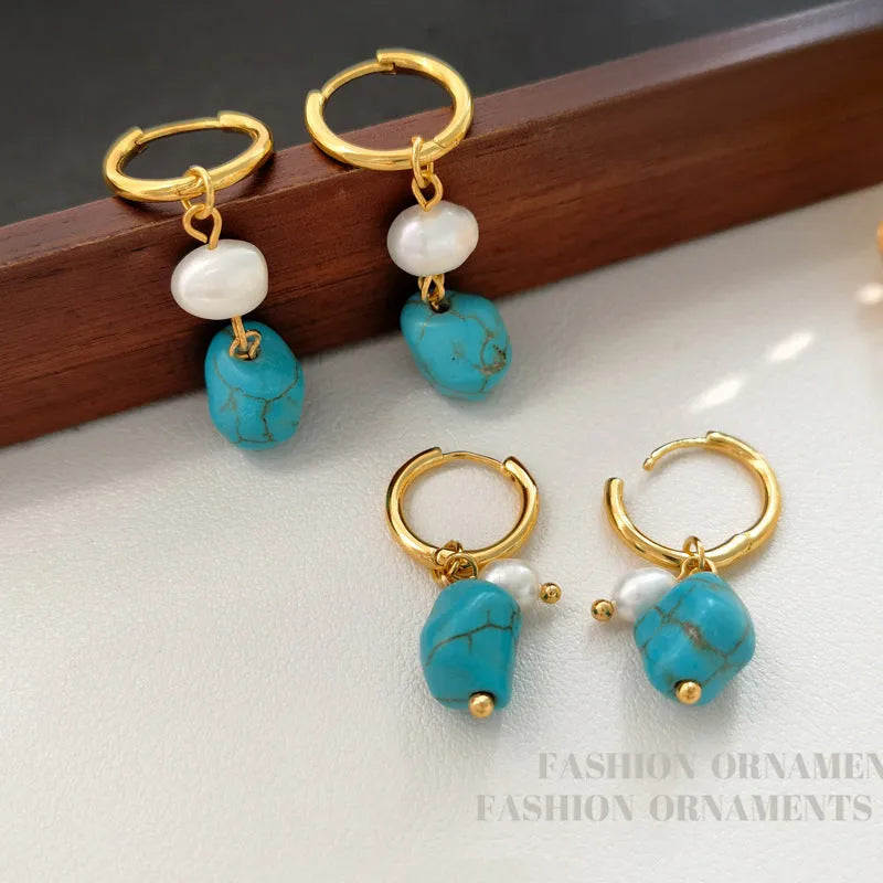 A pair of turquoise and cultured pearl clip-on earrings with irregular geometric copper shapes, showing both long and short styles.