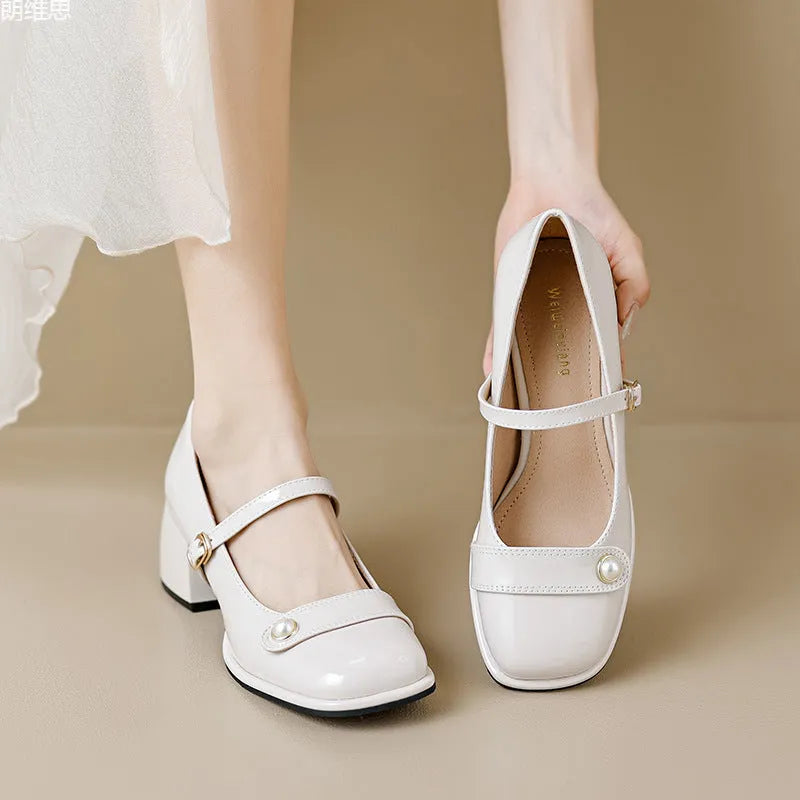 Women's apricot patent leather chunky heel pumps with a square toe and silver buckle fastening.