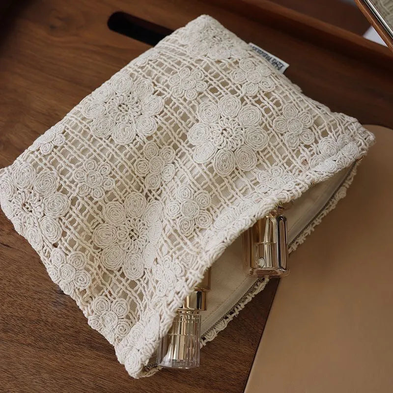 Handmade crocheted hollow flower cosmetic bag in corduroy with ethnic embroidery, solid rope colour.