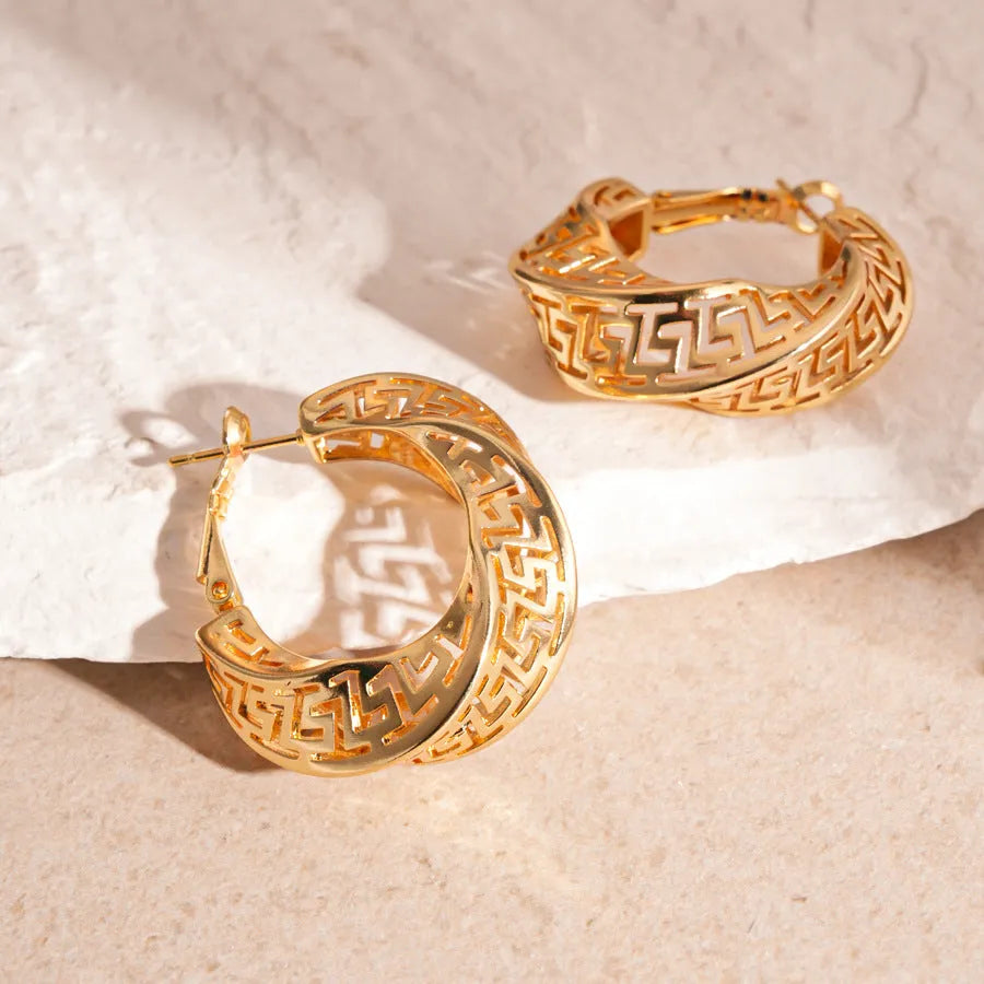 Women's geometric stud earrings with twisted round design in gold and silver electroplated copper