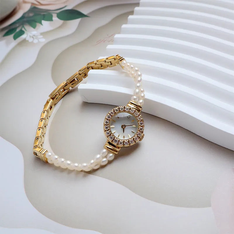 Women's light gold bracelet watch with freshwater pearls and 18mm mineral glass dial