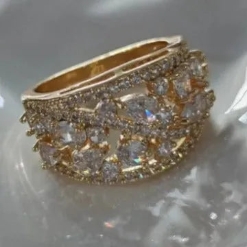 Women's hollow round copper fashion ring shown in gold and platinum colour finishes with a sizing chart.