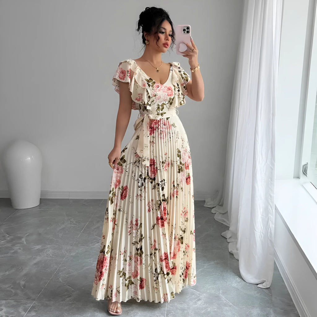 Apricot floral print V-neck dress with ruffled short sleeves and a long, flowing swing skirt.