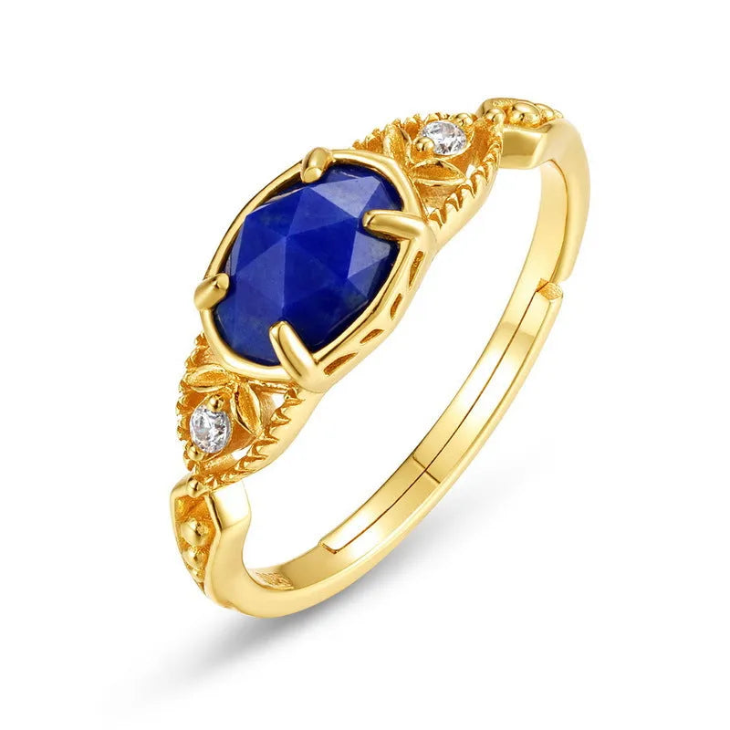 Geometric silver ring with deep blue lapis lazuli stone, elliptical shape with round decorative elements