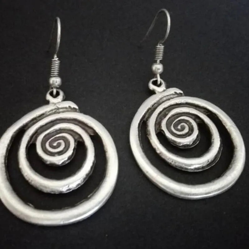 Silver geometric spiral earrings with distressed finish and national style design