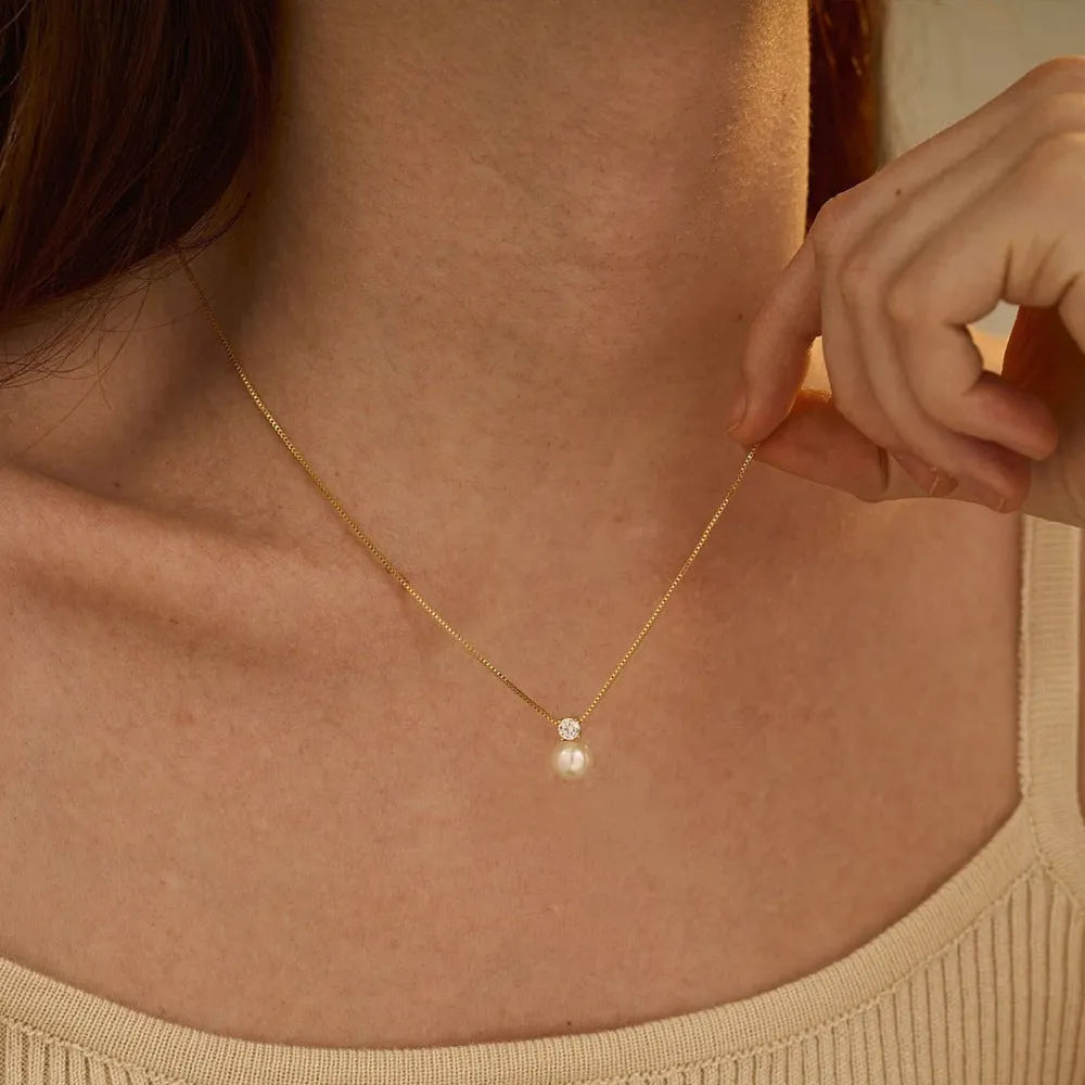 Simple stainless steel necklace with imitation pearl and zircon pendant on box chain