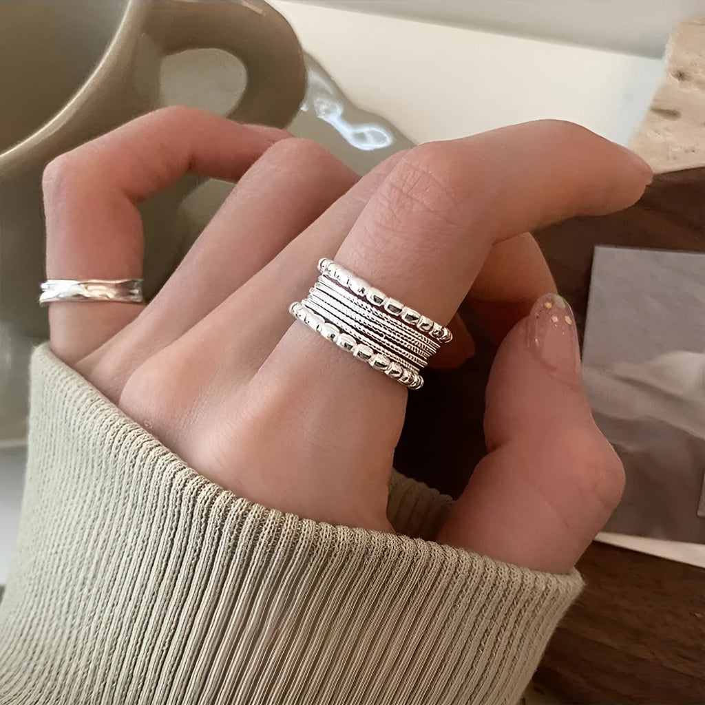 Adjustable opening copper ring with woven twisted multilayer geometric design