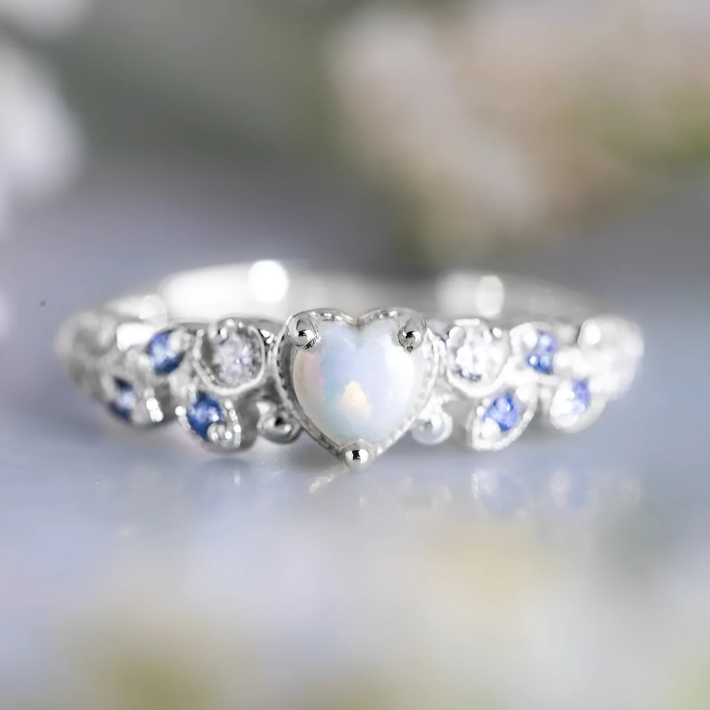 Women's white alloy peach heart ring with Flower Opal Ocean design showing detailed patterning