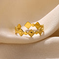 Geometric titanium steel women's ring in a gold diamond colour.