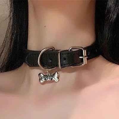 Black adjustable dog collar with regular chain showing cat paw, bone, and leather design options