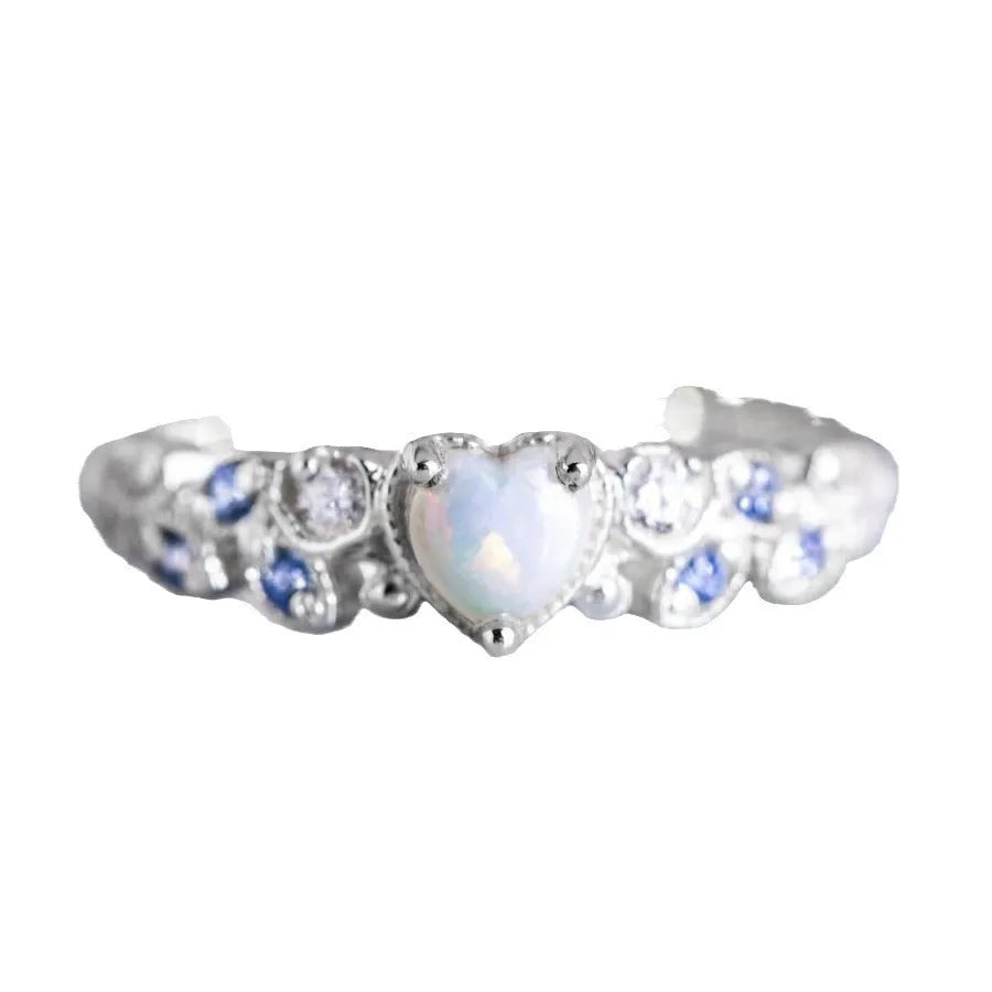 Women's white alloy peach heart ring with Flower Opal Ocean design showing detailed patterning