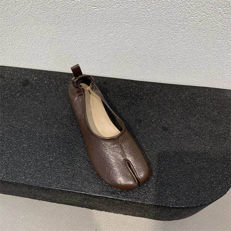 Women's black split toe horseshoe chunky heel pumps with rounded toe and rubber sole