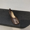 Women's black split toe horseshoe chunky heel pumps with rounded toe and rubber sole