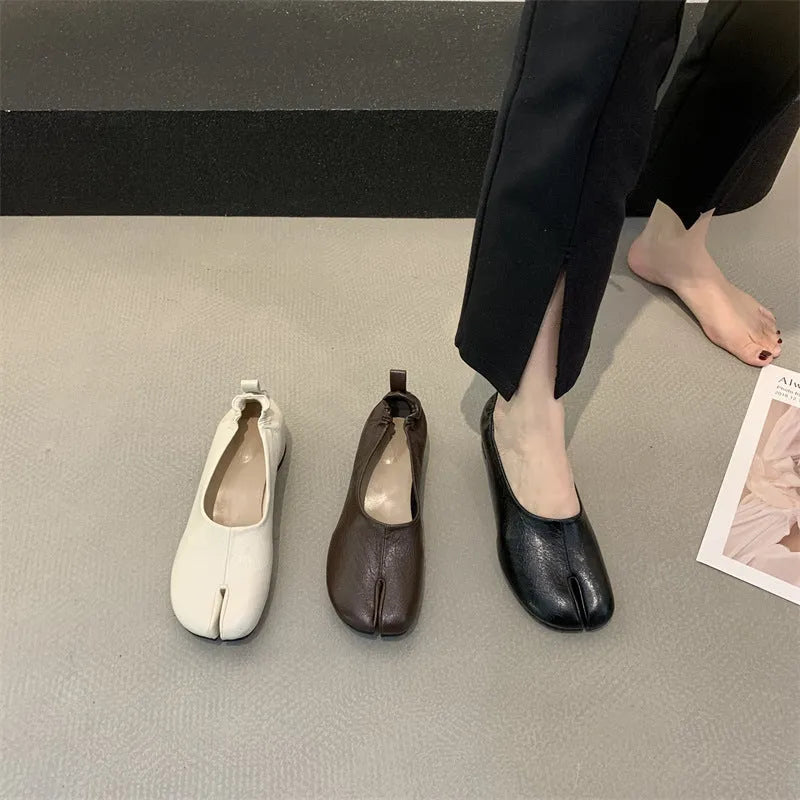 Women's black split toe horseshoe chunky heel pumps with rounded toe and rubber sole