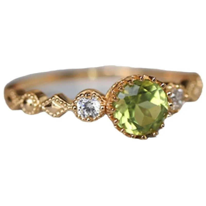 Japanese style geometric copper ring with imitation peridot centrepiece in quadrilateral design