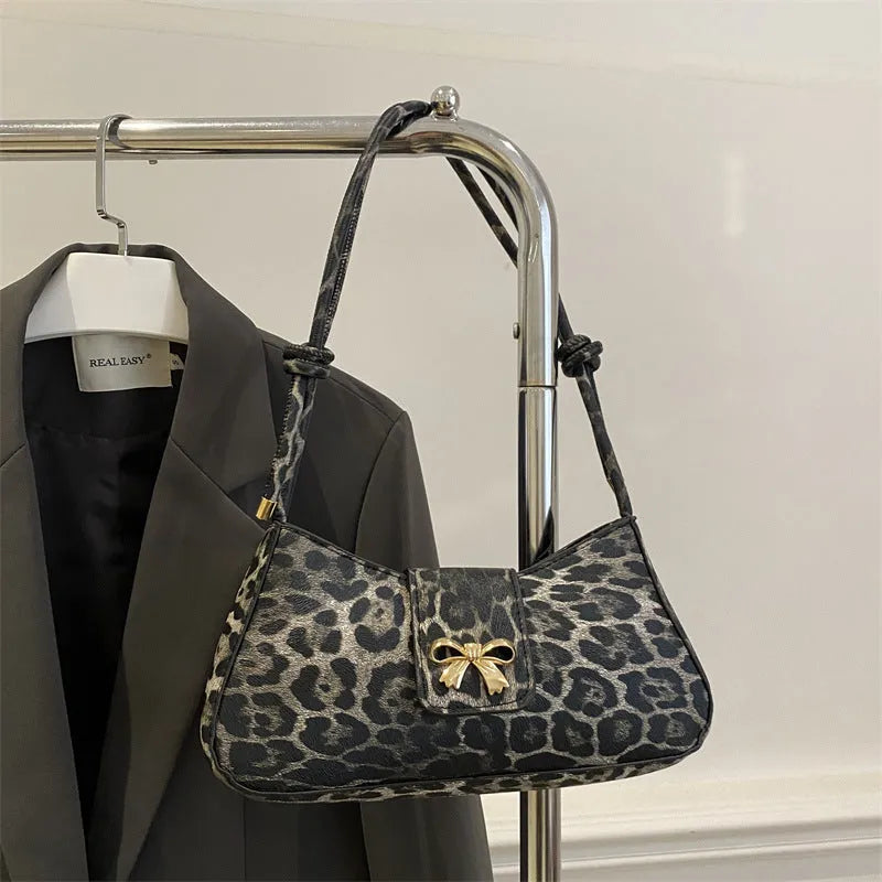 Women's casual PU handbag with sandwich pockets in black colour showing 27cm width