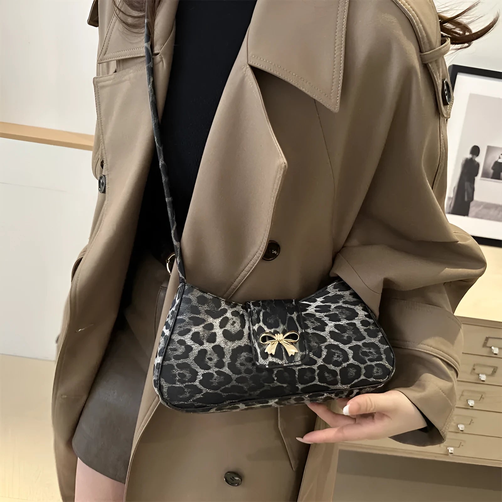 Women's casual PU handbag with sandwich pockets in black colour showing 27cm width