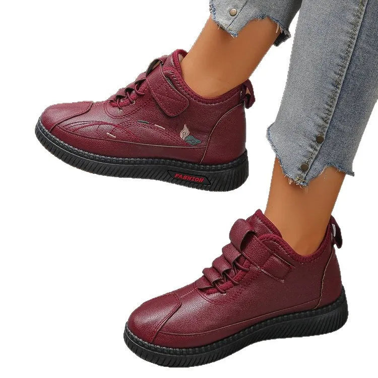 Women's black velvet house shoes with a non-slip rubber sole and hollow-out pattern