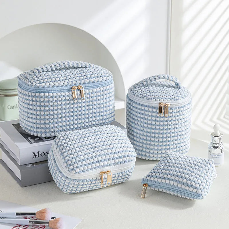 Four cube-style flannelette makeup bags in polyester with modern simplicity design