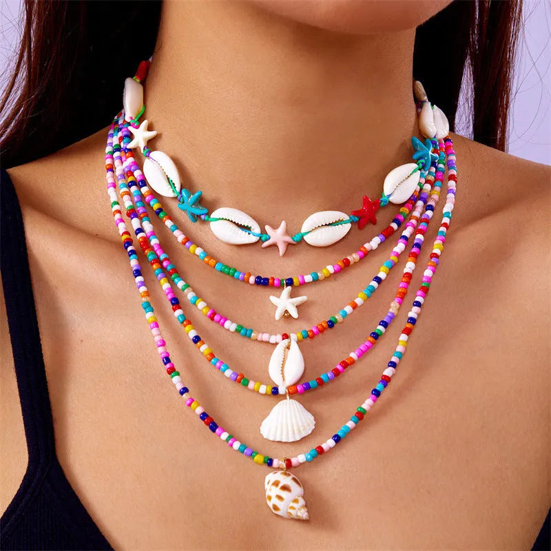 Women's starfish shell bead necklace 5-piece set with electroplated alloy pendants showing blue and mixed colour variations