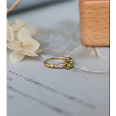 Japanese style geometric copper ring with imitation peridot centrepiece in quadrilateral design