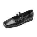 Women's silver leather Mary Jane flats with a cross-buckle strap and round toe.