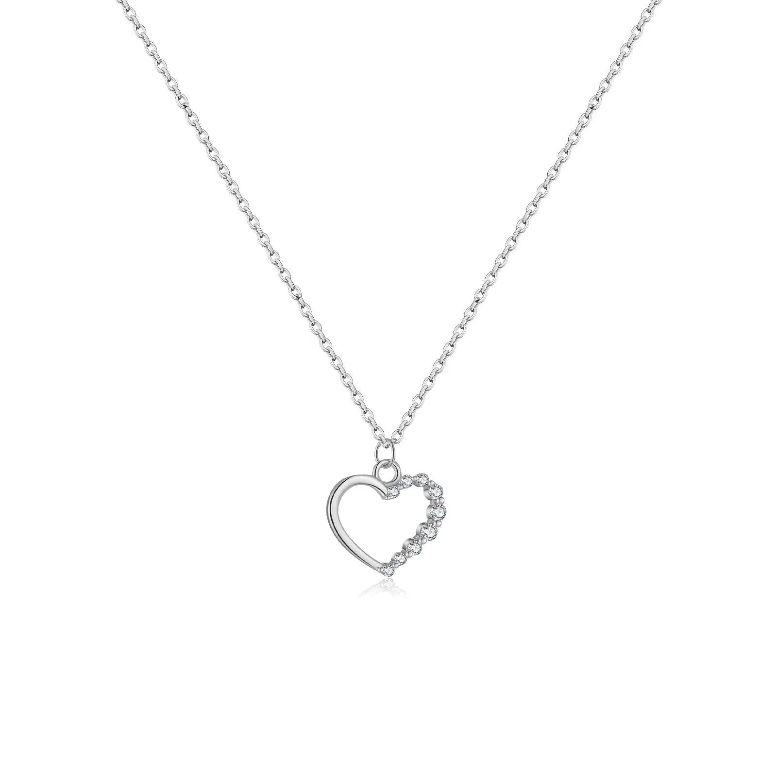Close-up of a sterling silver hollow heart pendant necklace on a regular chain.