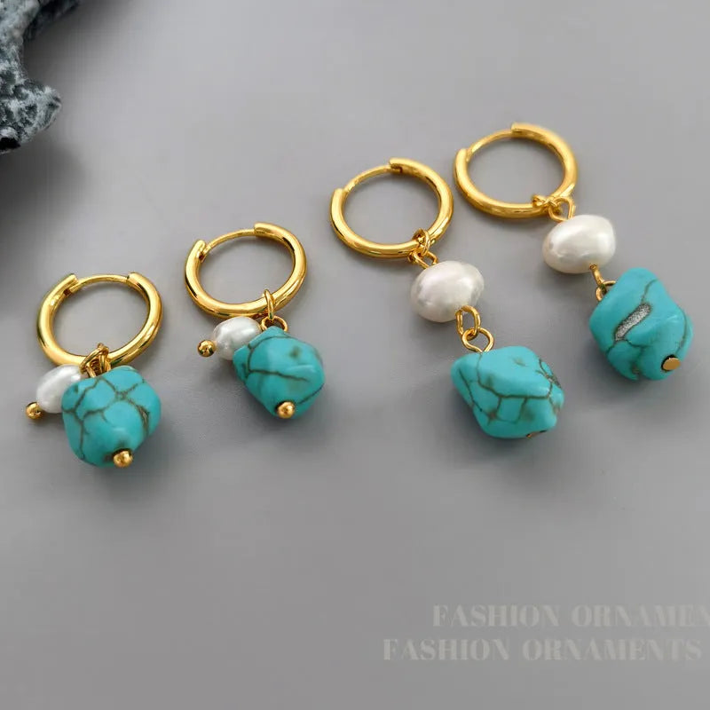 A pair of turquoise and cultured pearl clip-on earrings with irregular geometric copper shapes, showing both long and short styles.