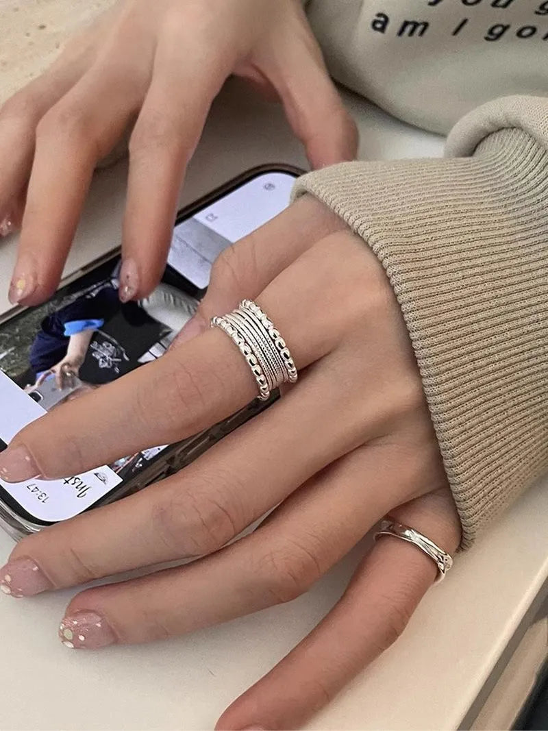 Adjustable opening copper ring with woven twisted multilayer geometric design