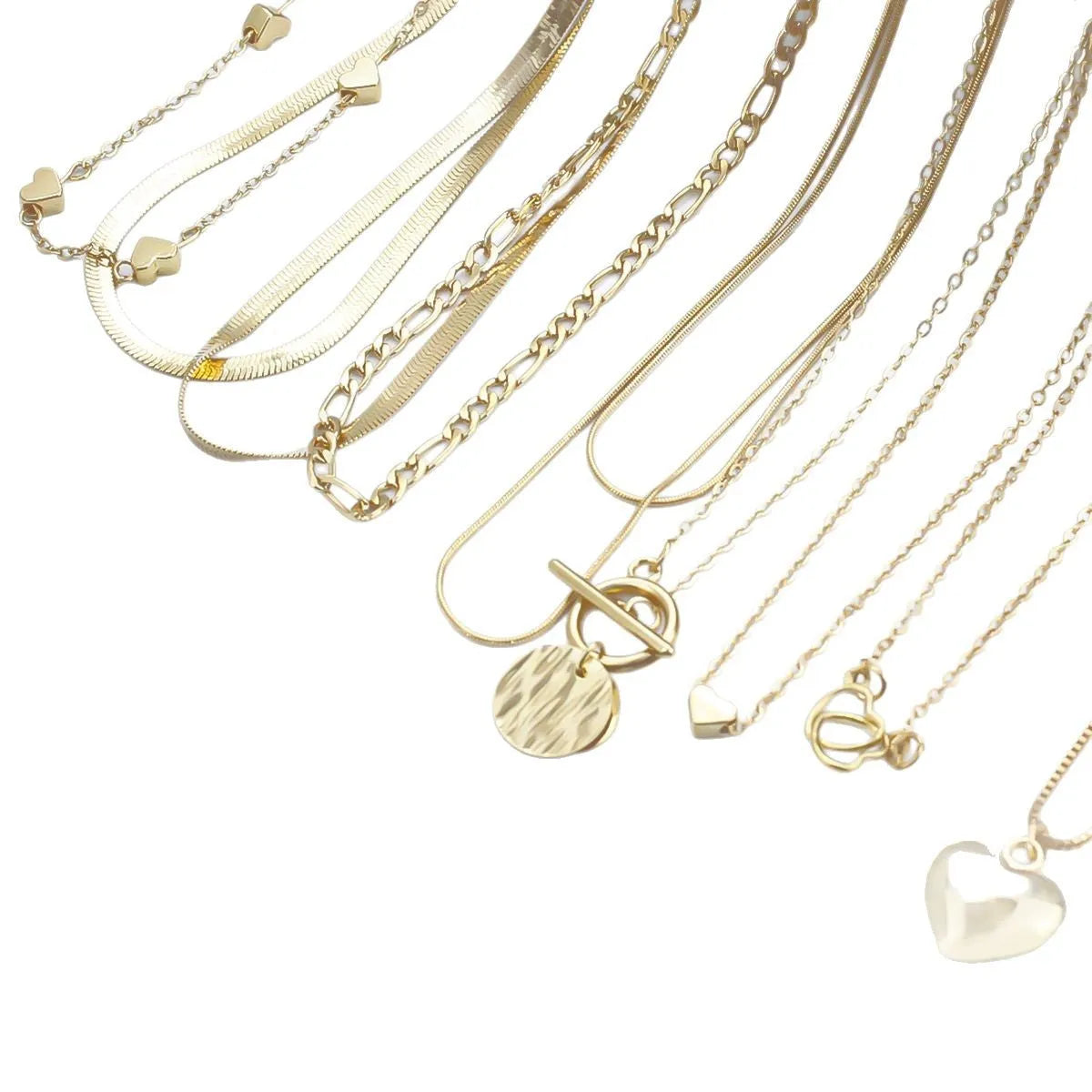 Set of 10 gold electroplated necklaces with alloy pendants on snake bone chains
